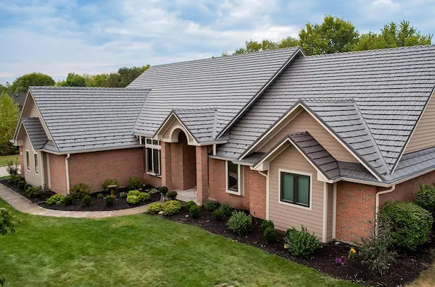 an image of a house with a well done roof and siding