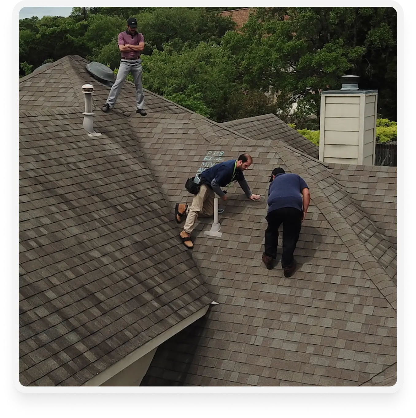 an image of crews fixing a storm damage roof