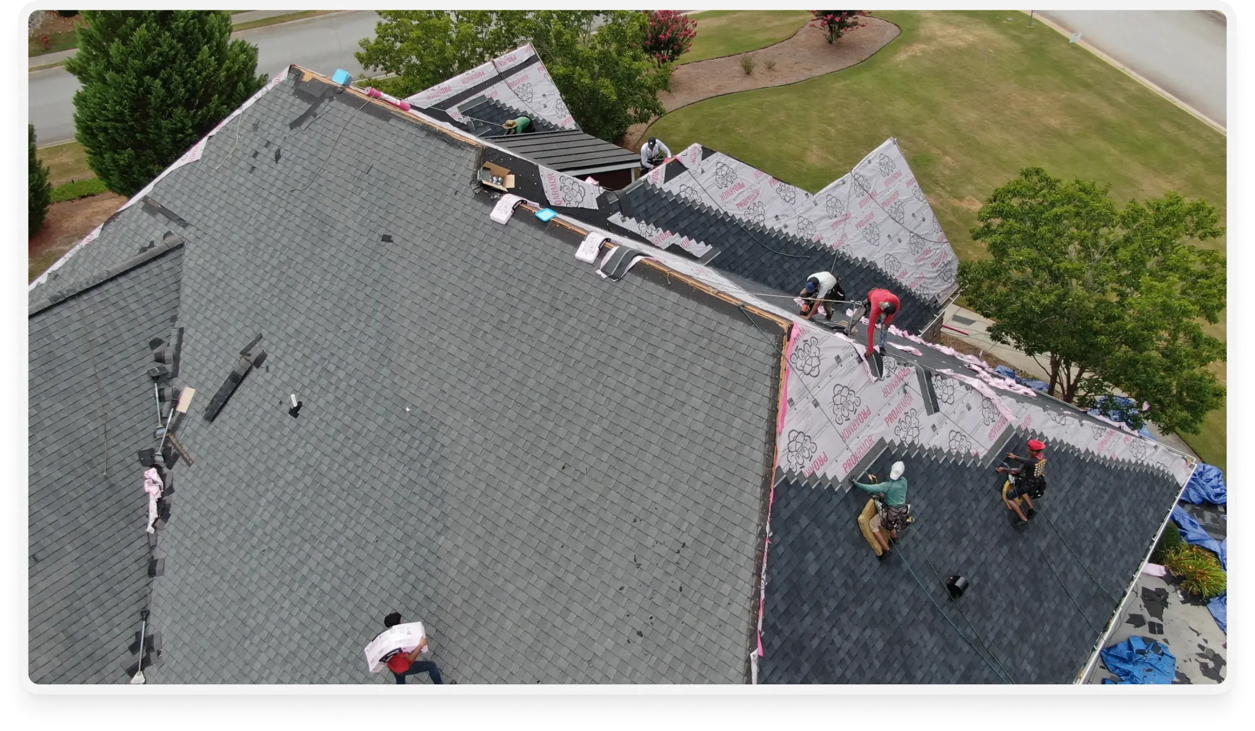 an image of a roof being fixed, insatlling shingles