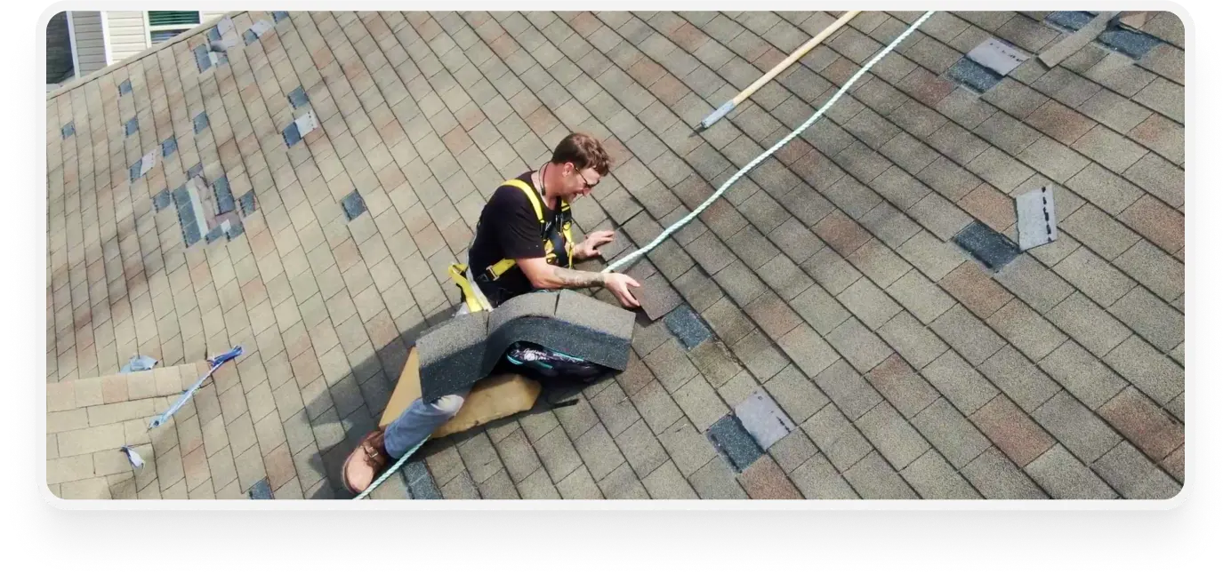 a man fixing a roof - roof repair image